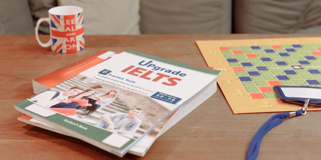 IELTS prep materials on a coffee table with a British flag mug and decor. Ideal for education themes.